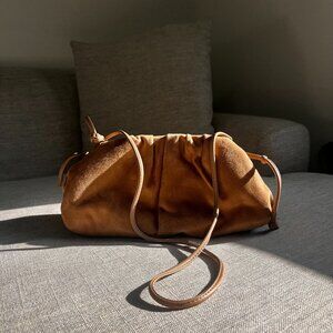 beige crossbody or clutch bag